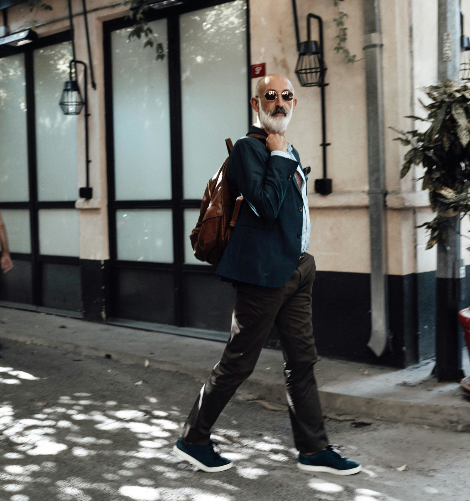senior man walking in town sightseeing